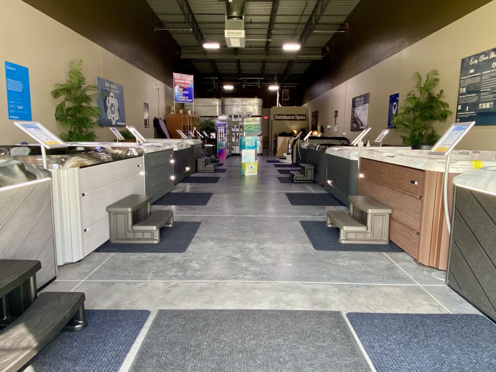 Interior of the Omaha Hot Tubs showroom with Sundance spas on display